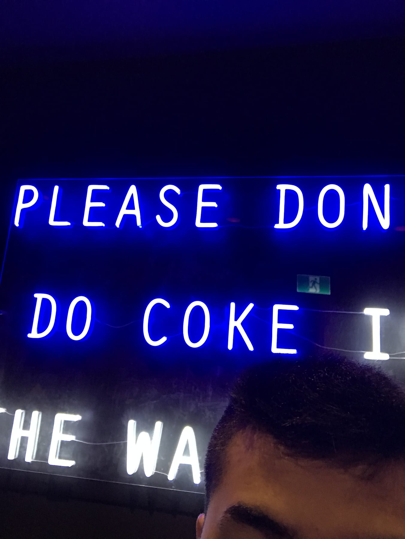 A neon sign inside the karaoke bar
