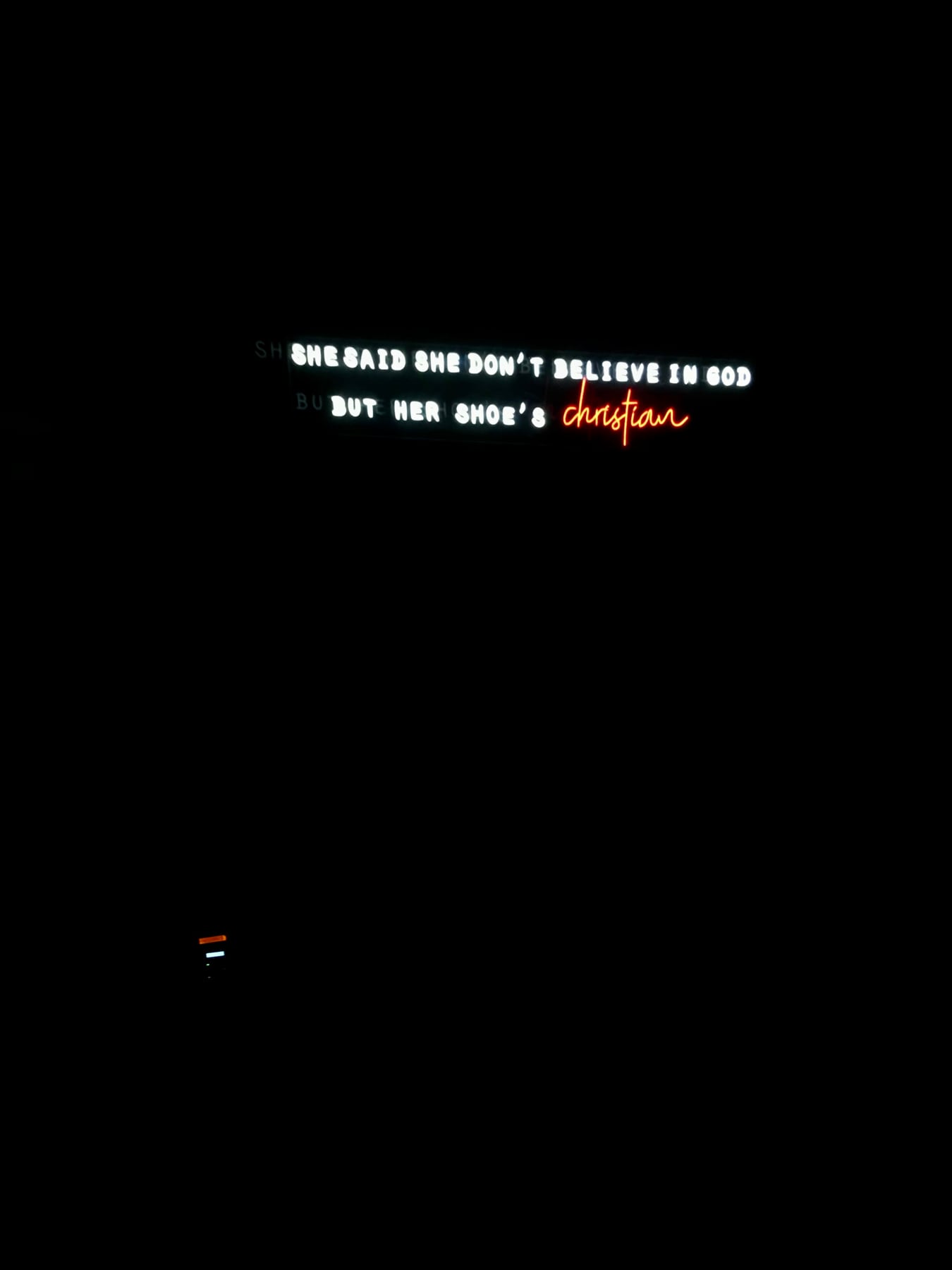 Karaoke lyric screen with a caption about Christian shoes